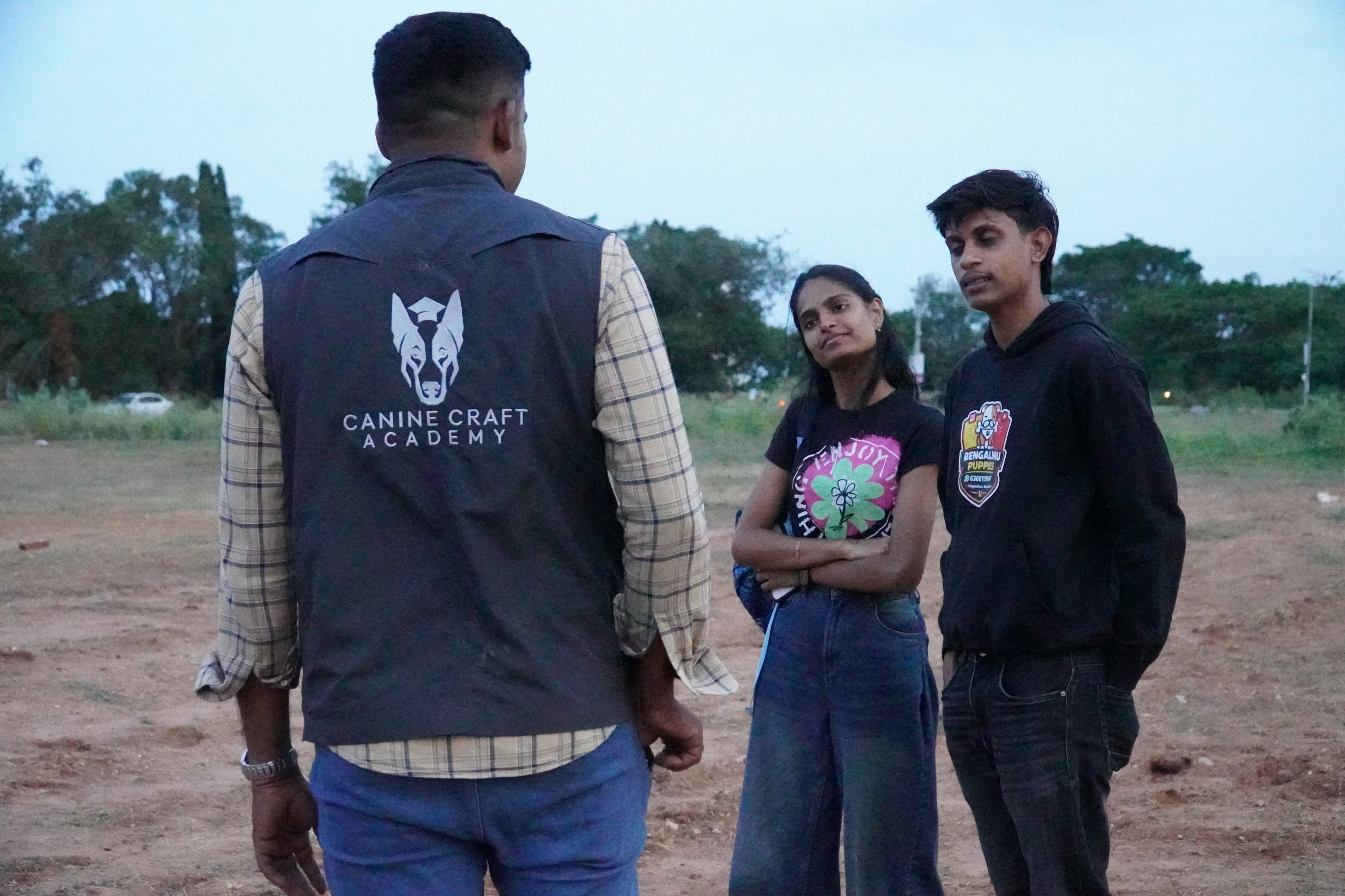 Trainer briefing young handlers before an evening session